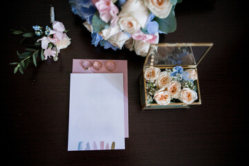 wedding invitation with bridal bouquet and rings