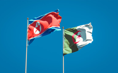 Beautiful national state flags of North Korea and Algeria together at the sky background. 3D artwork concept.