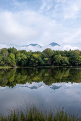 Obraz premium View of forest reflecting in one of Shiretoko Five Lakes