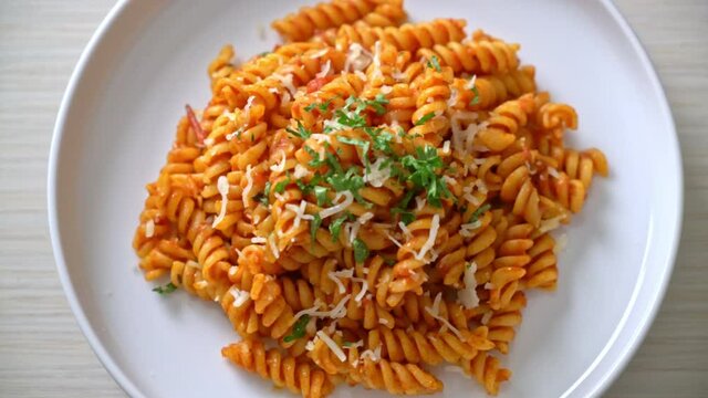 spiral or spirali pasta with tomato sauce and cheese - Italian food style