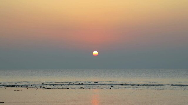 Sunset over the ocean at Lakshmanpur beach no 1 and sunset point on Neil Island on Andaman and Nicobar Islands, India.