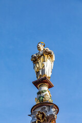 Fototapeta premium medieval Market cross on central square. Archbishop Henry I equipped the cross in 958 on main town market, in Trier, Germany