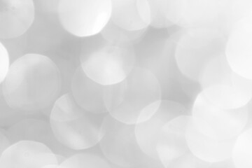 A brilliant blurry white background for a festive mood. Template for greeting card for entertainment.