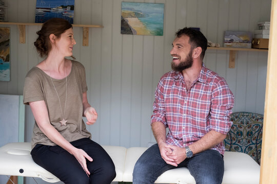Alternative therapist and man during a consultation, using EFT tapping techniques therapy 