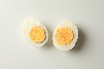 Boiled egg on white background, top view