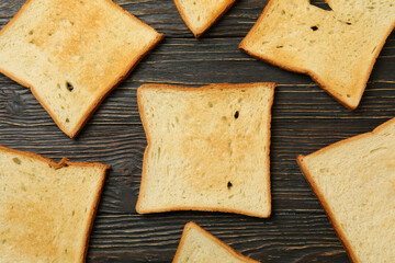 Flat lay with toast breads on wooden background