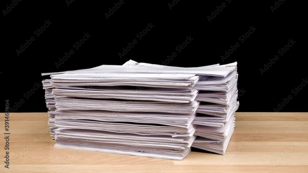 Poster stop motion animation stacks overload document paper files on office desk isolated on black backgrou
