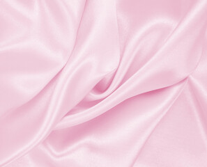 Obraz premium Smooth elegant pink silk or satin texture as wedding background. Luxurious background design