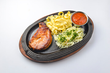 Grilled steak meat with baked potatoes and green salad with dip sauce. Delicious full dinner.