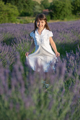 Beautiful little girl in a lavender field in Italy