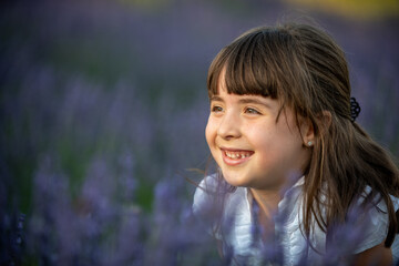 Beautiful little girl in a lavender field in Italy