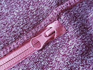 pink lock with a slider on the knitted fabric.
