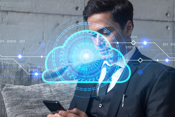 Businessman in office working with Smartphone, IT Cloud hologram to optimize the working process, typing phone. Double exposure.