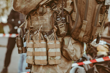 a soldier holds a weapon in his hands