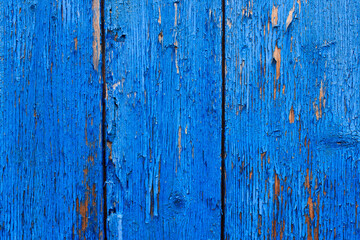 Weathered blue wood background texture. Worn turquoise or turquoise-green wood is painted. Vintage wooden background.