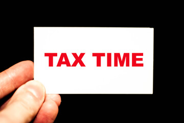 Business card with the words Tax Time. Expression for tax officials.