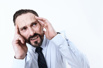 A man in a shirt with a strong migraine in head.
