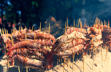 Shrimp skewers on charcoal at the fair