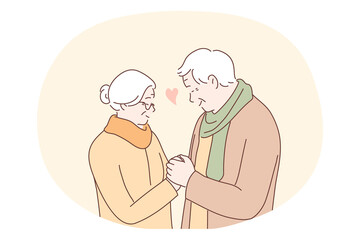 Senior elderly couple living happy active lifestyle concept. Mature aged couple grandparents cartoon characters standing, holding hands and looking at each other with love and tenderness 