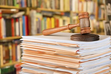 Judge wooden hammer and stack documents