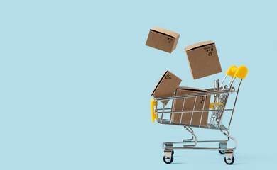 Toy shopping cart with boxes in air on blue background. Copy space for text or design. Sale,...