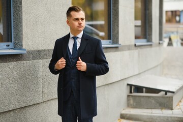 young business man, wearing stylish classic suit