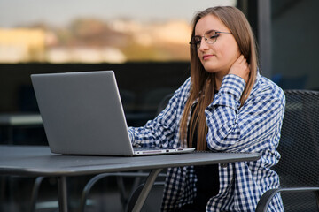 The programmer girl works at the computer	Girls in science. In an empty office during a pandemic.