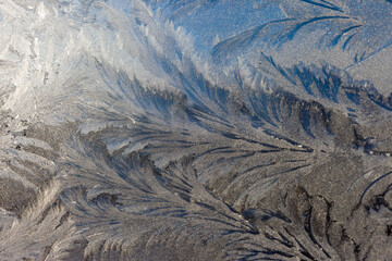 .the frosty patterns on the window