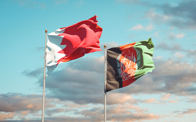 Beautiful national state flags of Afghanistan and Bahrain together at the sky background. 3D artwork concept.