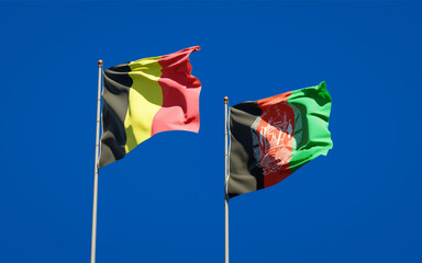 Beautiful national state flags of Afghanistan and Belgium together at the sky background. 3D artwork concept.