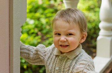 Happy child laughing in autumn outdoors.