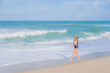 Portrait beautiful young asian woman relax smile around beach sea ocean