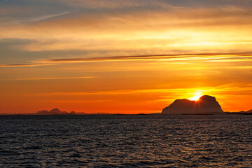Naklejka na ściany i meble Sunset on a rocky archipelago from the sea