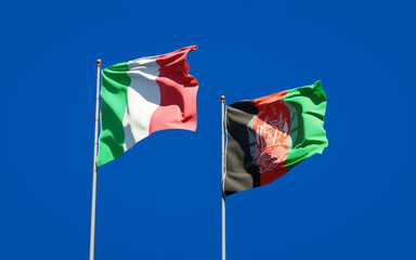 Beautiful national state flags of Italy and Afghanistan together at the sky background. 3D artwork concept.