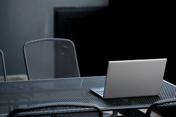The programmer girl works at the computer	Girls in science. In an empty office during a pandemic.