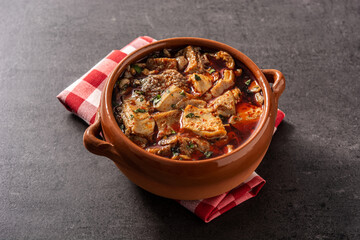 Traditional mondongo or el menudo soup on black stone