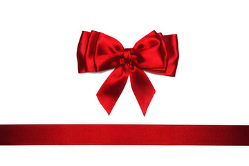 Red satin bow and ribbon on white background