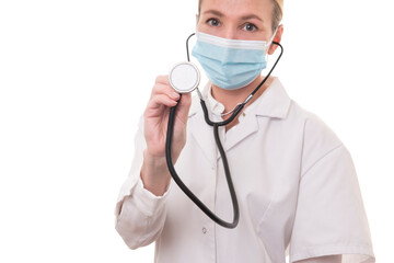 Young doctor in white uniform and stethoscope wearing mask on isolated background
