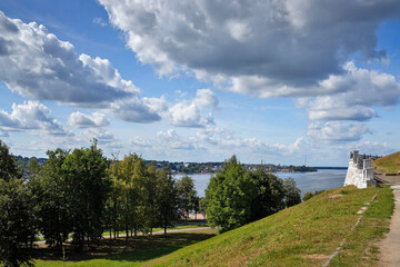 Fototapeta na wymiar Kostroma. Summer day on the Bank of the Volga. Panorama of the river and old stairs and fences in Central Park.
