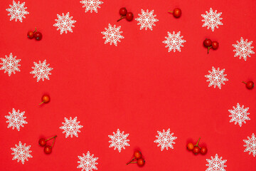 Winter banner. Red berry, white snowflakes in shape frame on red background for greeting card. Christmas, winter, new year concept.