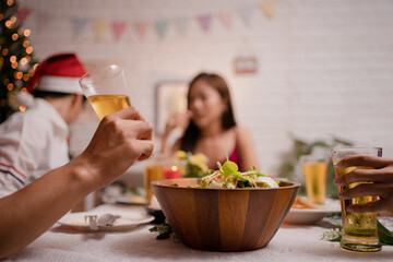 Group of Asian people at the party and drinking beer at home