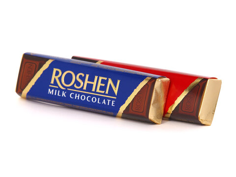 BUCHAREST, ROMANIA - OCTOBER 12, 2019. Roshen Milk and Dark chocolate bars isolated on white made by Roshen Confectionery Corporation