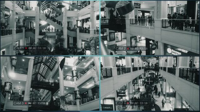 Security Cameras CCTV Mall Surveillance System. CCTV cameras surveillance system in a crowded shopping mall. Multiscreen monitor.