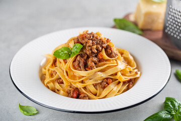 Tagliatelle al ragu - italian pasta with meat bolognese sauce. High angel. Extra hard cheese on...