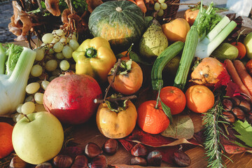 rustic autumn composition of fruits and vegetables - top view
