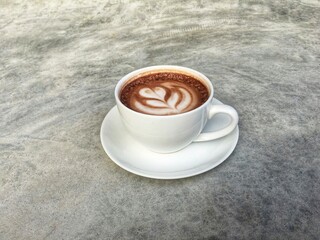 Hot cocoa in white cup. Hot chocolate in white cup.