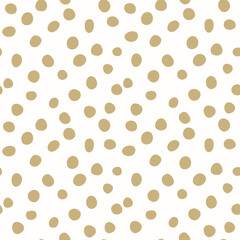 Cute modern hand drawn gold polka dots vector seamless pattern on white background. Great for fabric, textile, scrapbooking and wallpaper. Surface pattern design.
