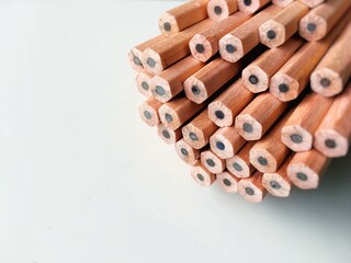 Brown pencils on white background.