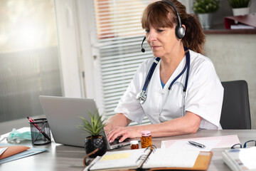Portrait of female doctor during online medical consultation