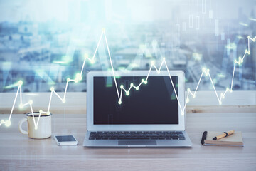 Stock market graph and table with computer background. Multi exposure. Concept of financial analysis.